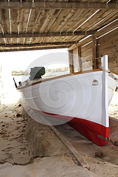 Formentera boat stranded on wooden rails