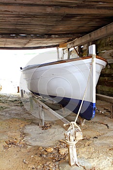 Formentera boat stranded on wooden rails