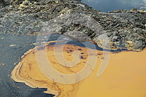 Former dump toxic waste, effects nature from contaminated soil and water with chemicals and oil, environmental disaster