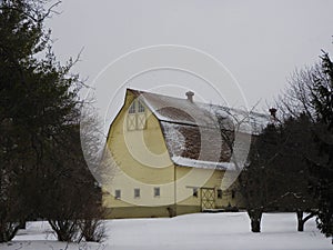 Former Gilead School yellow gambrel barn in Lansing NY