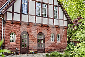 Former historic fire station with a brick facade and half-timbering