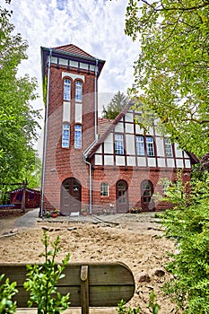 Former historic fire station with a brick facade and half-timbering