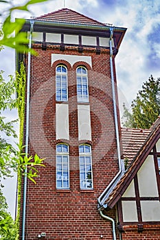 Former historic fire station with a brick facade and half-timbering