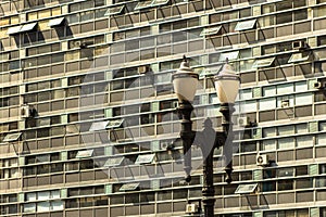 Former public lighting pole at Santa Ifigenia Viaduct with windows office building