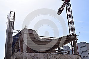 store ruin with a cran during deconstruction photo