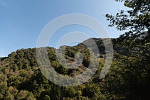 Formigueiros peak Courel hillside with autumn sunlight and blue sky