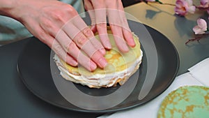 Forming a pancake cake with delicate buttercream