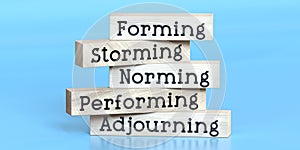 Forming, storming, norming, performing, adjourning - words on wooden blocks photo