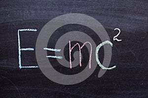 A formula from physics on a chalkboard. E equals MC square
