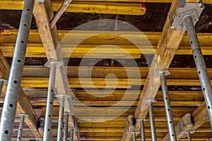 formwork - metal poles supporting the slabs on which concrete will be poured to make the ceiling in the building