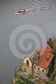 Forsaken church with graffiti on the bank of Duoro river photo