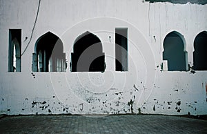 Forsaken house with windows in arabian style