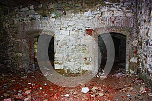 Fort Bastione, a nineteenth-century military fortress, abandoned to the neglect of nature. distressing stone construction inside