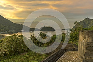 Fort Belgica scene in the evening and Gunung Api volcano are two landmark places in Banda islands, Maluku, Indonesia