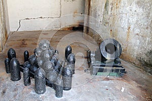 Fort cannon and munitions in room photo
