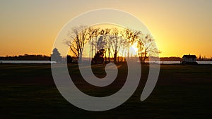 Fort Mott State Park waterfront, sunset view with Delaware River, Pennsville Township, NJ, USA photo