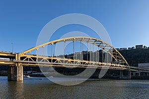 Fort Pitt Bridge and Monongahela River in Pittsburgh in Pennsylvania. Sunset Sky and Light
