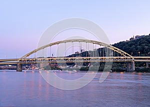 Fort Pitt Bridge and Monongahela River in Pittsburgh in Pennsylvania. Sunset Sky and Light