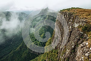 Fortaleza Canyon with steep rocky cliffs and fog