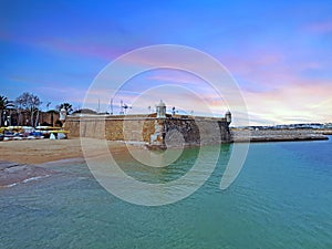 Forte da Bandeira in Lagos in Portugal at sunset photo