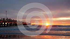 Forte dei Marmi: People admiring  a wonderful fiery sunset from the famous pier