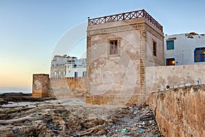 Fortification wall in Essaouira, Morocco, at sunset.