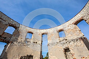 Fortification wall of a ruin of a ancient castle in Poland. Janowiec Castle. Wide perspective view with blue sky in the background