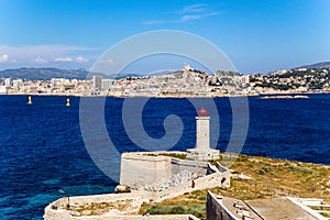 Fortifications and lighthouse on the island of If. In the background, Marseille, France
