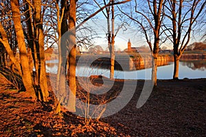 The fortifications and moats of the city of Naarden, Netherlands, with the Grote Kerk church in the background