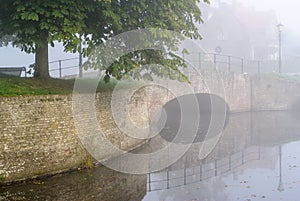 Fortified bridge reflection in water