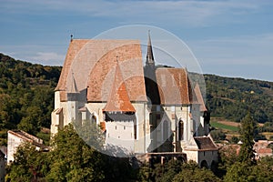 Fortified church with defence wall and tower