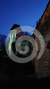 Fortified citadel of Sighisoara, Romania, by night - UNESCO heritage - historical landmarks