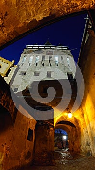 Fortified citadel of Sighisoara, Romania, by night - UNESCO heritage - historical landmarks