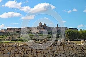 The fortified city of Mdina in Malta stands tall on the horizon