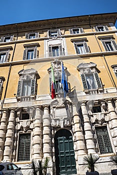 Fortified public building with impressive facade in Rome Italy that has books as the main theme