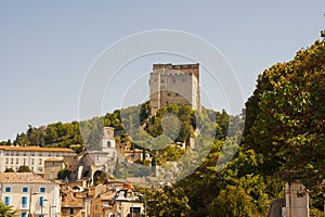 The fortified tower that dominates the skyline at Pont De Barret in the Drome Valley in the South of France photo