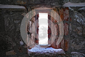 Fortress embrasure with snow photo