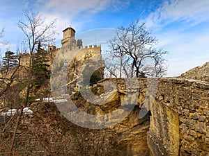 The Fortress Guaita viewed from The Pass of the Witches with stone bridge, San Marino