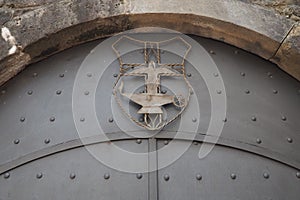 Fortress metal door with rivets. Old medieval castle in Kotor, Montenegro. Entry iron door with pattern. Medieval style