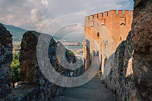 Fortress ruins of the historical Red Tower - Kizil Kule, in Alanya Castle.