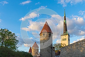 Fortress towers and St. Olaf`s church against blue sky and cloud