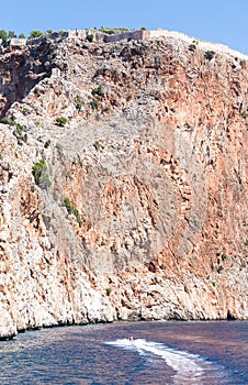 Fortress wall on a cliff by the sea