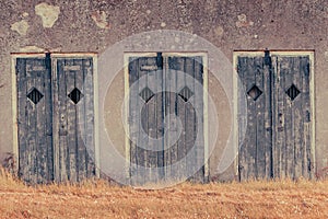 Fortress wall with wooden doors with bars