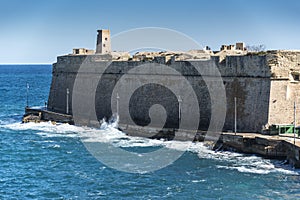 Fortress walls and gun post tower Valletta Malta