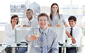 Fortunate business team drinking champagne