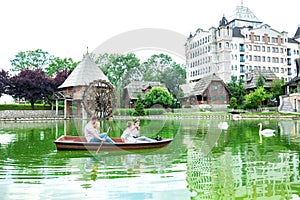 Fortunate family boating on a small lake