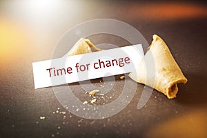 A fortune cookie with message time for change