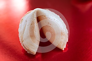 Fortune cookie on red background