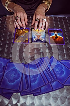 Fortune teller forecasting the future with tarot cards