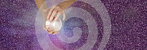 Fortune Teller holding crystal ball on sparkling banner